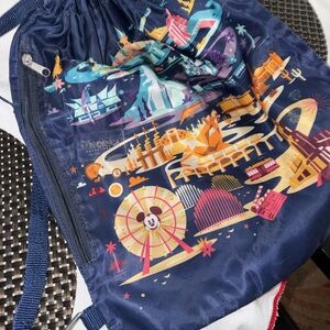 Disney Navy Blue Drawstring Backpack with Colorful Theme Park Design